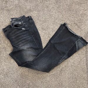 High-Rise Black Flared Jeans with Subtle Distressing